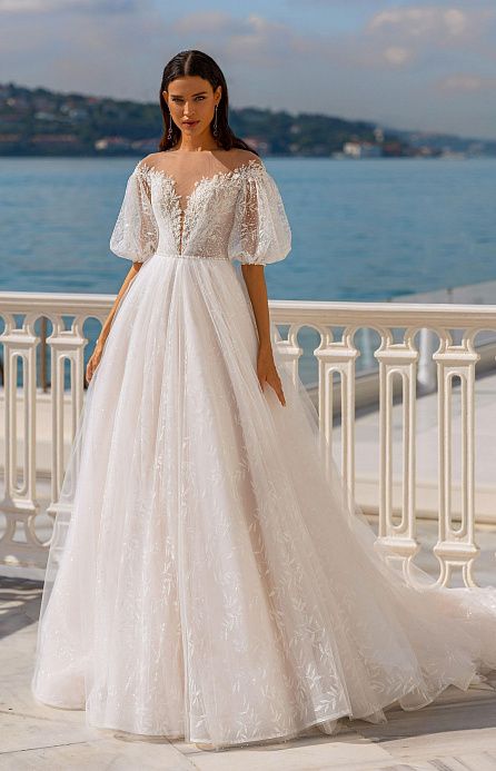 Кружевное свадебное платье с пышными рукавами фото