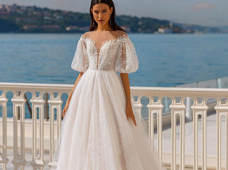 Кружевное свадебное платье с пышными рукавами фото