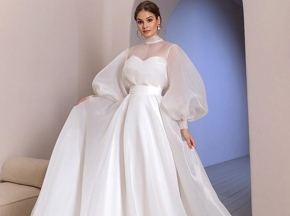 Закрытое свадебное платье с объемными рукавами фото