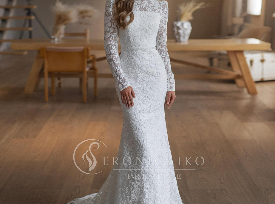 Закрытое кружевное свадебное платье с рукавчиками фото
