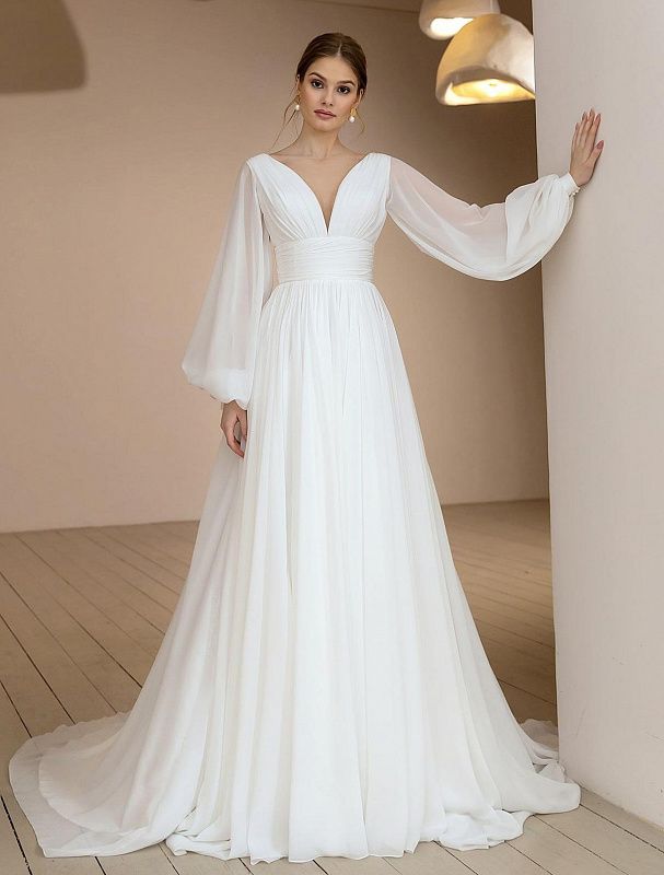 Воздушное свадебное платье с объемными рукавами купить в Москве
